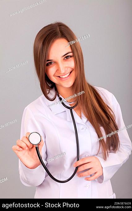 Doctor listening to young girls chest with stethoscope, Stock Photo,  Picture And Royalty Free Image. Pic. WR0353381