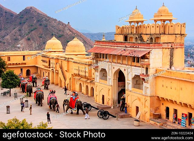 Decorated elephants entering Suraj Pol in Jaleb Chowk (main courtyard) in Amber Fort, Rajasthan, India. Elephant rides are popular tourist attraction in Amber...