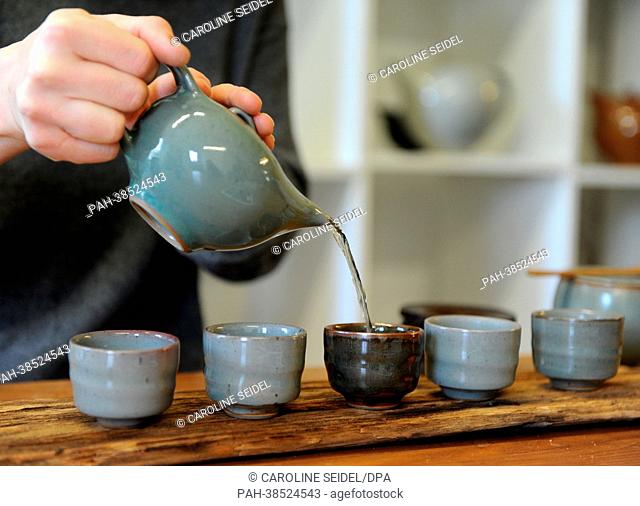 An employee of the Ceramic studio Margaretenhöhe prepares an Asian tea ceremony with the ceramic dishes in the atelier in Essen, Germany, 27 March 2013