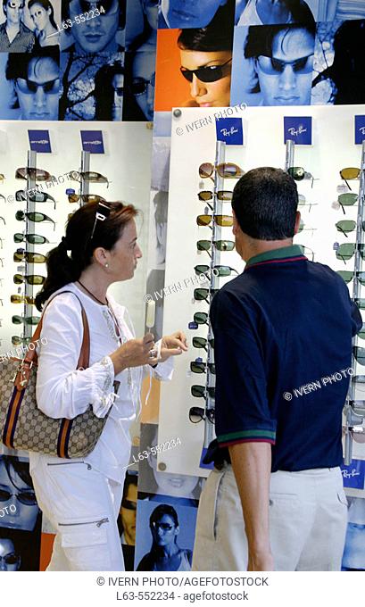 Couple shopping on a optical store. Cambrils. Tarragona. Spain