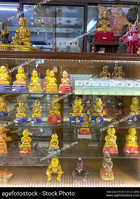 23 June 2020, Thailand, -: Kuman Thong figures are sold at the temple Wat Samngam. A Kuman Thong figurine said to contain ashes with human remains