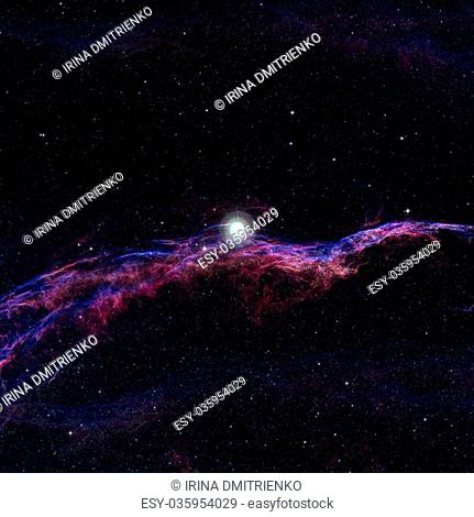 The Veil Nebula or The Witch's Broom Nebula is a cloud of heated and ionized gas and dust in the constellation Cygnus. Elements of this image furnished by NASA