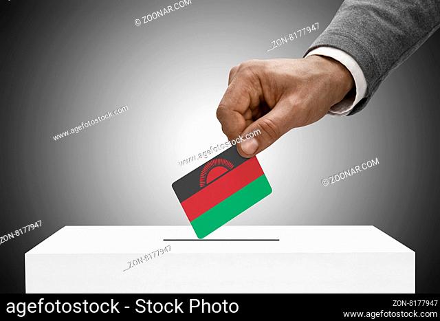 Black male holding flag. Voting concept - Malawi
