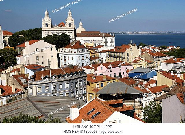 Portugal, Lisbon, view of Alfama District and Sao Vicente de Fora Monastery, Tagus River in the background