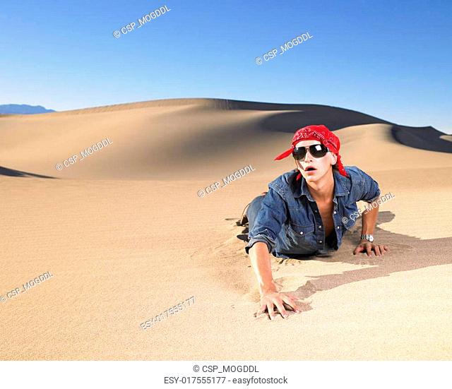 Thirsty man crawling through the desert Stock Photos and Images |  agefotostock