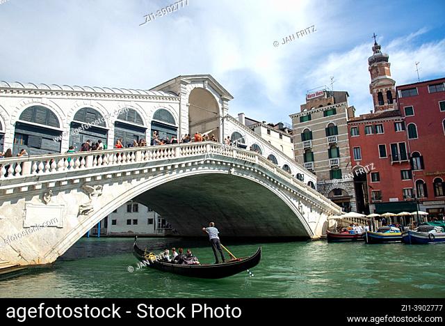 gondola and Rialto bridge in Venice, Italy