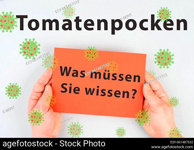 The words tomato pox, what you need to know, are standing in german language on a paper, outbreak of the virus in India, infectious disease spreading
