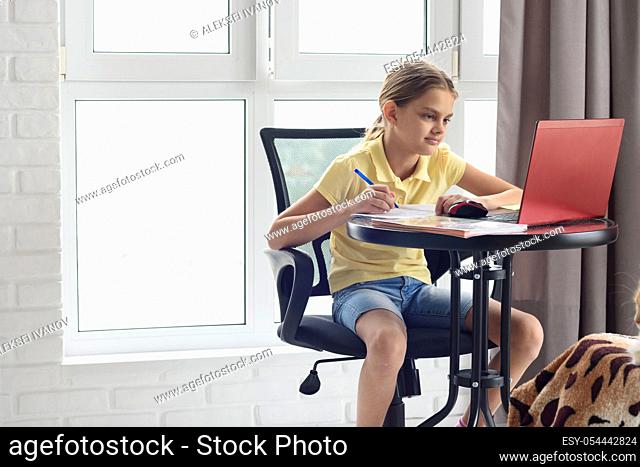 Girl studying remotely online while at home