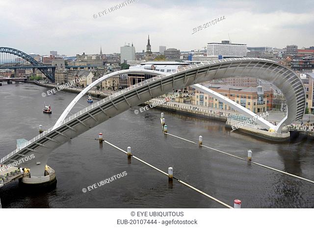 Millennium Bridge in open position from the Baltic Arts Centre looking towards Newcastle Quayside and Newcastle upon Tyne city