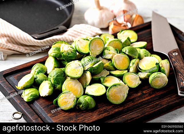 Fresh Brussels sprouts on a wooden background