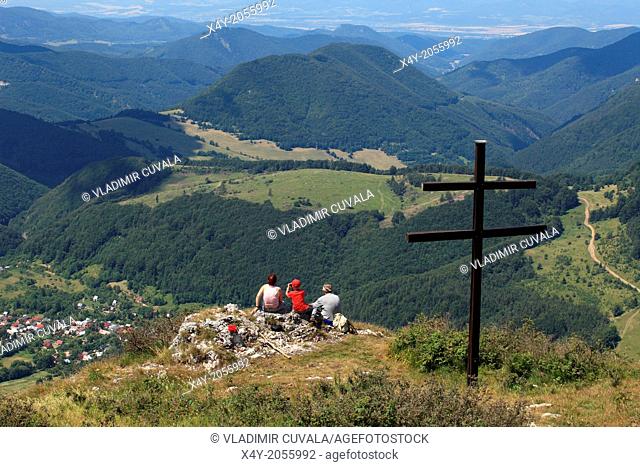 Three people looking on village Zliechov from Strazov peak, Strazovske vrchy, Slovakia