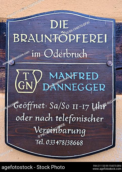 26 November 2021, Brandenburg, Groß Neuendorf: A company sign of the brownware pottery of Manfred Dannegger. He is one of the last brownware potters in Germany