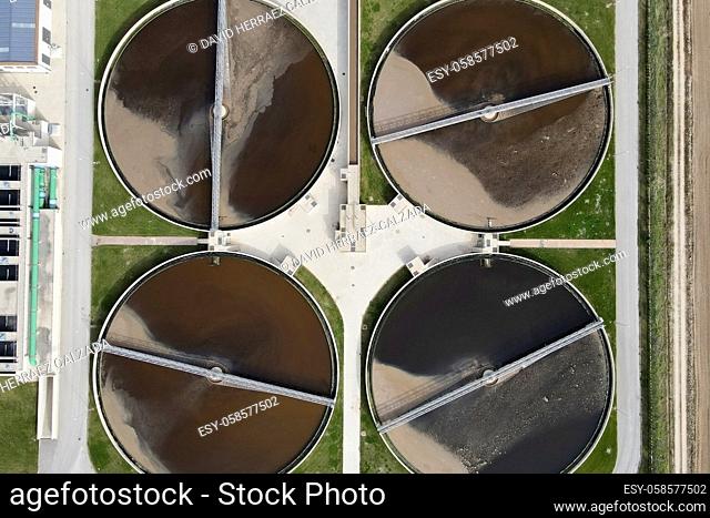 Aerial top view of round polls in wastewater treatment plant, filtration of dirty or sewage water. High quality photo