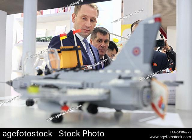 NORTH KOREA, PYONGYANG - NOVEMBER 16, 2023: Russia's Natural Resources and Ecology Minister Alexander Kozlov (L) attends an exhibition of North Korean consumer...