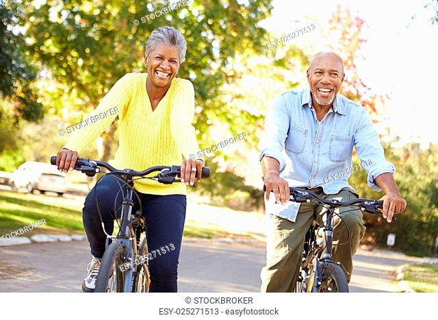 Senior Couple On Cycle Ride In Countryside