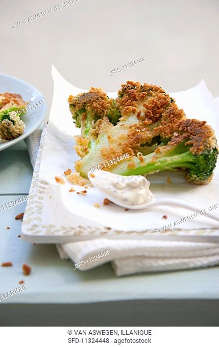 Fried broccoli florets with a Panko coating and a mustard dip