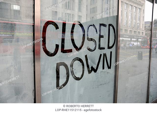 England, London, Westminster. Closed Down written on a shop window