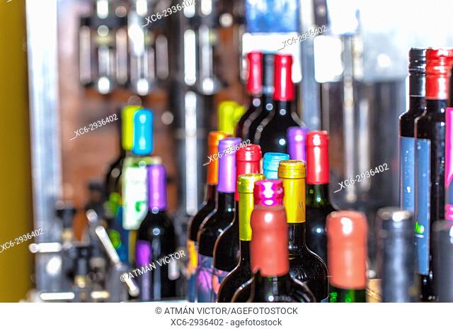 wine bottles stacked in a wine cellar