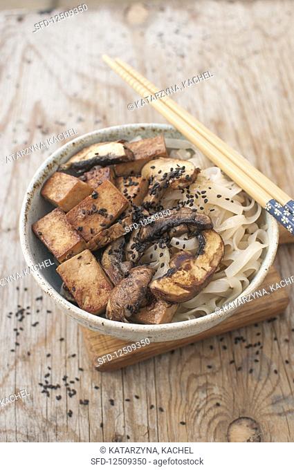 Vegan stir fry - rice noodles, tofu, mushrooms, sesame