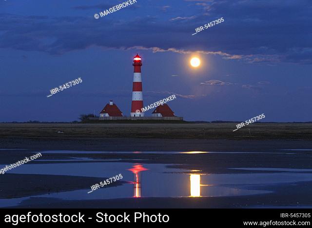 Westerheversand lighthouse at night and full moon in Westerhever, Wadden Sea National Park, North Frisia, Schleswig-Holstein, Germany, Europe