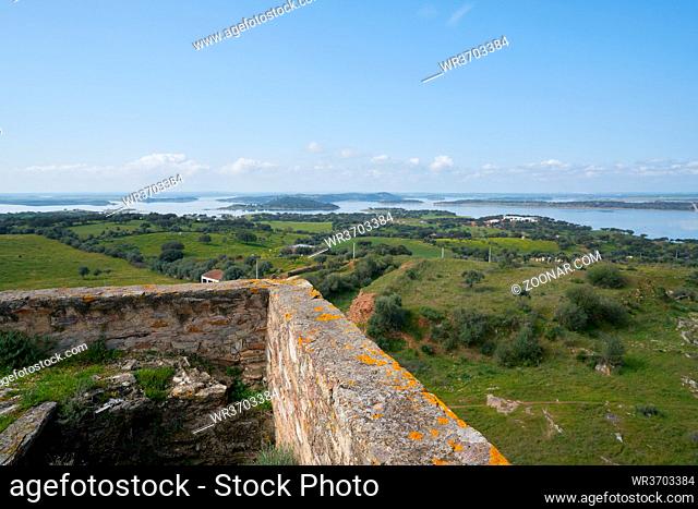Lake water reservoir of Alqueva Dam landscape from Mourao castle in Alentejo, Portugal