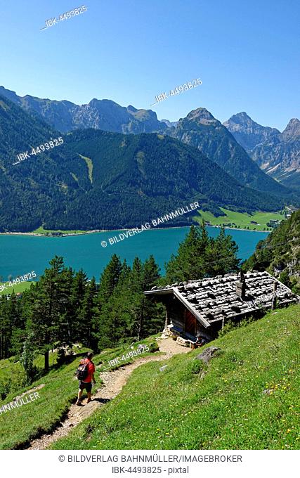 Hiker at Teisslalm, Lake Achen, Rofan Mountains, Tyrol, Austria
