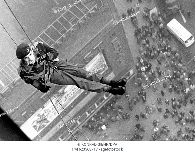 A British parachutist ropes down from the more than 87 metres high Europa Center in Berlin on 3 November 1975. With this breath-taking campaign