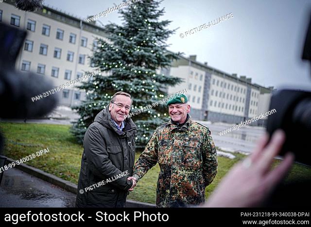 18 December 2023, Lithuania, Rukla: Boris Pistorius (l, SPD), Federal Minister of Defense, is received in Rukla by Commander Klaus-Peter Berger