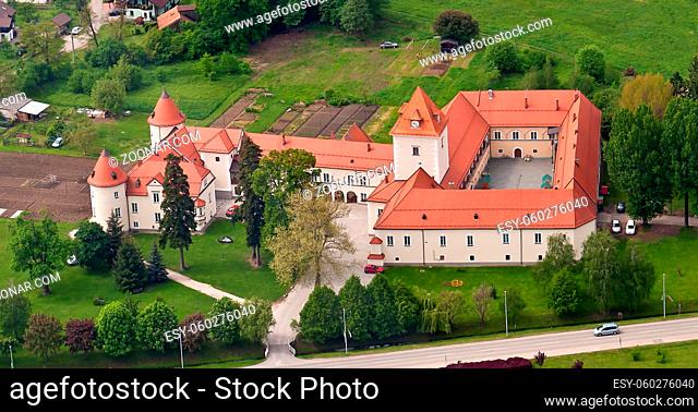 Medieval castle in European village, municipality Race Fram in Slovenia, aerial view, lower Styria near Maribor