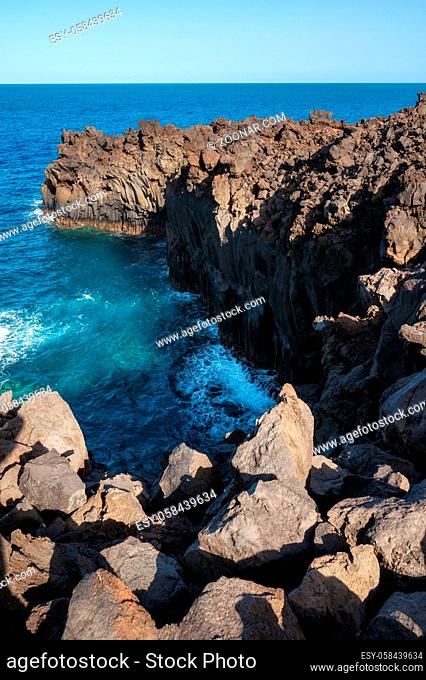 Volcanic coastline landscape. Rocks and lava formations in El Hierro, Canary islands, Spain. High quality photo