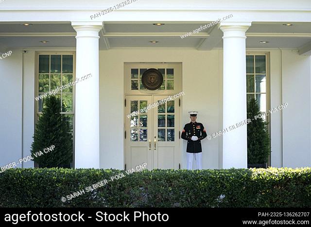 A Marine is seen on duty outside of the West Wing where it has been reported that U.S President Donald Trump is being briefed on the status of coronavirus...