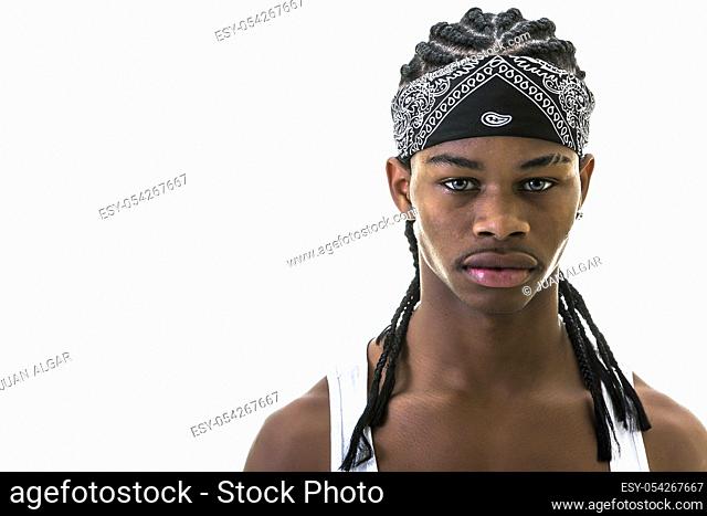 Young black man in stylish urban do-rag looking at camera isolated on white