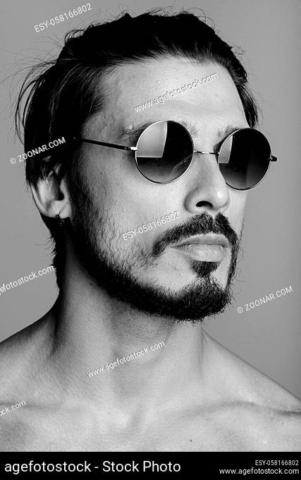 Face of handsome man thinking with sunglasses