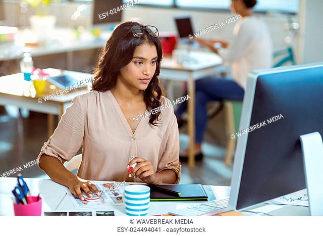 Businesswoman using graphic tablet