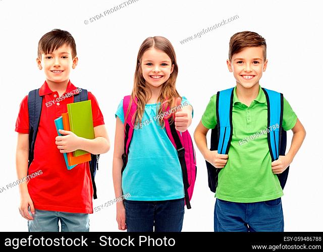 happy children with school bags showing thumbs up