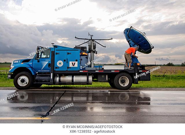 Doppler on Wheels driver Herb Stein ties down the radar dish near Des Moines, Iowa, June 5, 2010, after a storm chase  Herb and the DOW are participating in...