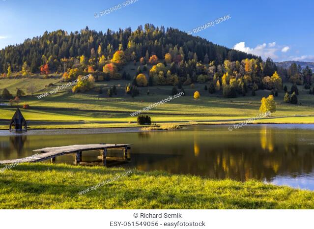 autumn pond under the mountains, Murau district, . . Styria, Austria