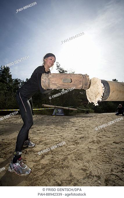 Participants in the Strong Viking Run obstacle course race in Fuerstenau, Germany, 11 March 2017. The participants must complete a race over numerous artificial...