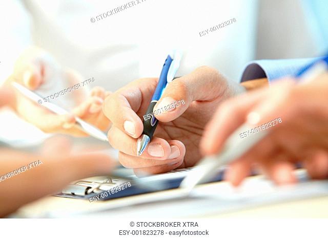 Image of human hand writing at seminar or conference