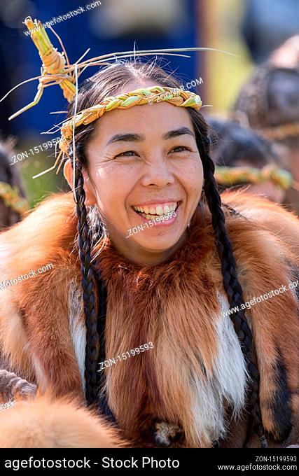Itelmens national ritual festival of thanksgiving nature Alhalalalay. Portrait of expression young woman in clothing indigenous people