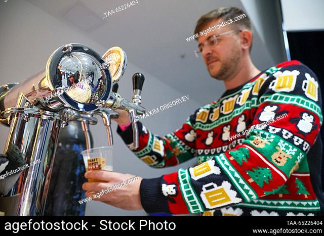 RUSSIA, MOSCOW - NOVEMBER 26, 2023: A participant in the Craft Depot Fest beer festival at the Amber Plaza business centre