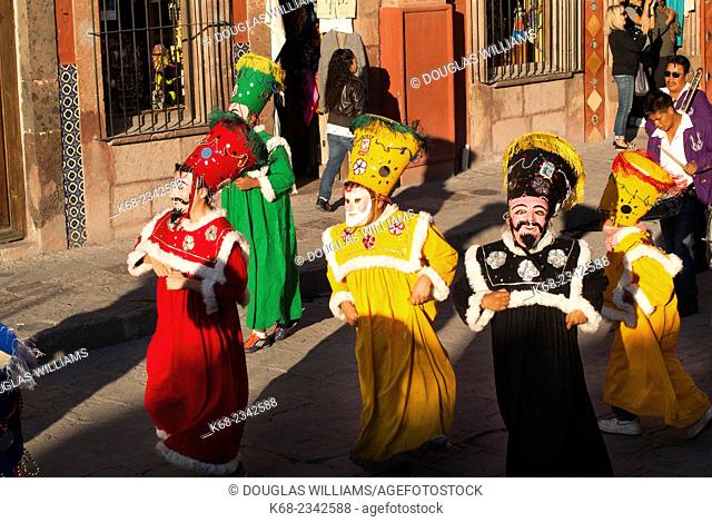 Costumed characters in a procession in San Miguel de Allende, Guanajuato State, Mexico