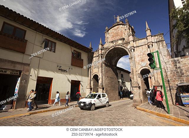 View to the Arco Santa Clara- Santa Clara Arch with local people in the foreground at the historic center, Cusco, Peru, South America