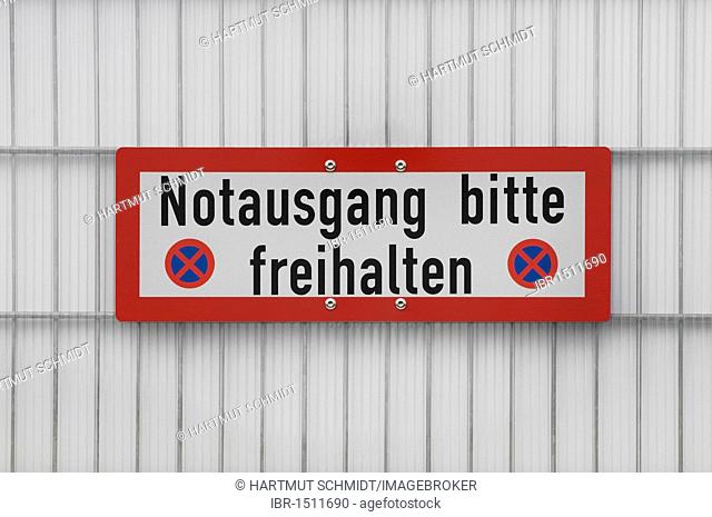 Sign Notausgang bitte freihalten, German for please keep clear, emergency exit