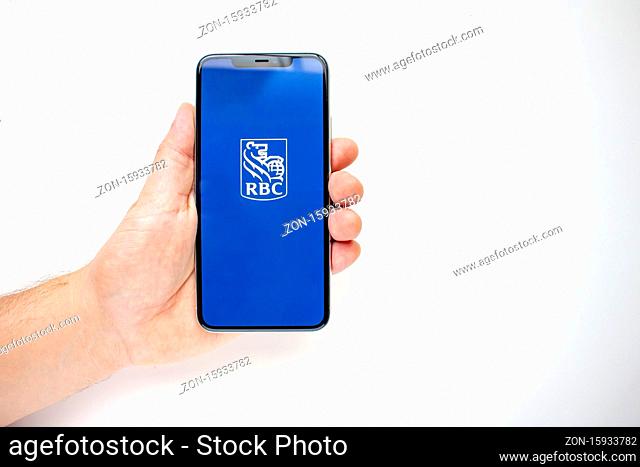 Calgary, Alberta, Canada. Aug 15, 2020. A person holding an iPhone 11 Pro Max with the RBC App