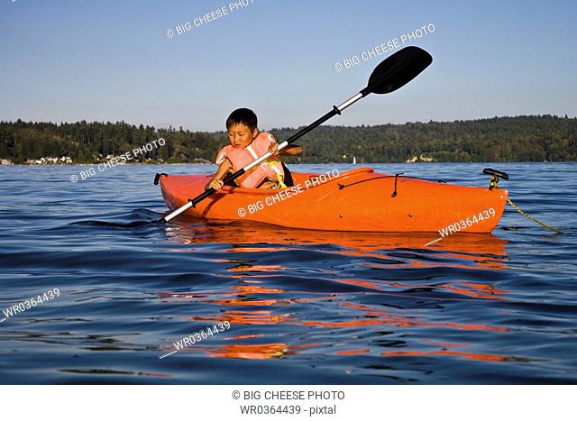 boy kayaking in puget sound