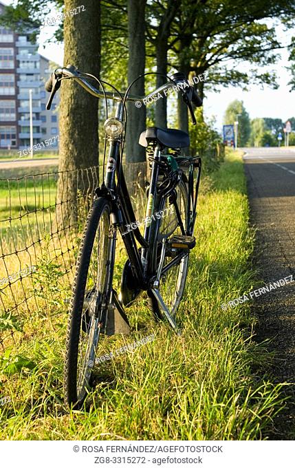 Road and bicycle at sunset, Barendrecht, near Rotterdam, Holland, The Netherlands