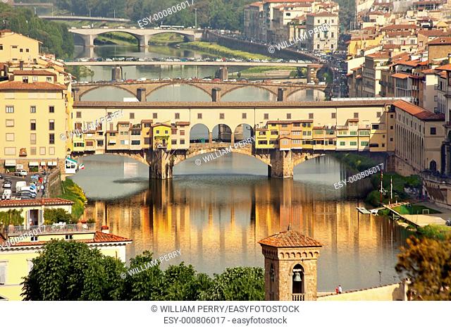 Ponte Vecchio Covered Bridge Arno River Reflection Florence Italy Bridge is the oldest bridge in Florence built in 1345 by Neri di Fioravante from Michelangelo...