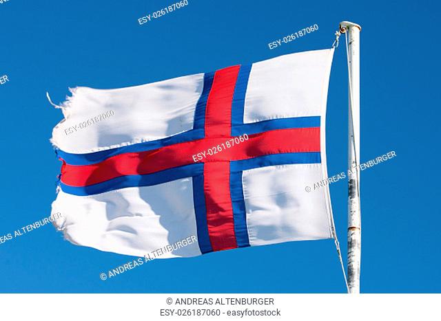 Flag of the Faroe Islands on a white flag pole