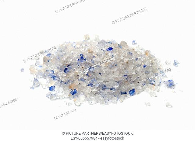 Heap of Persian blue salt on white background